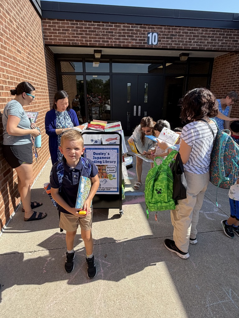 Students and families looking at books