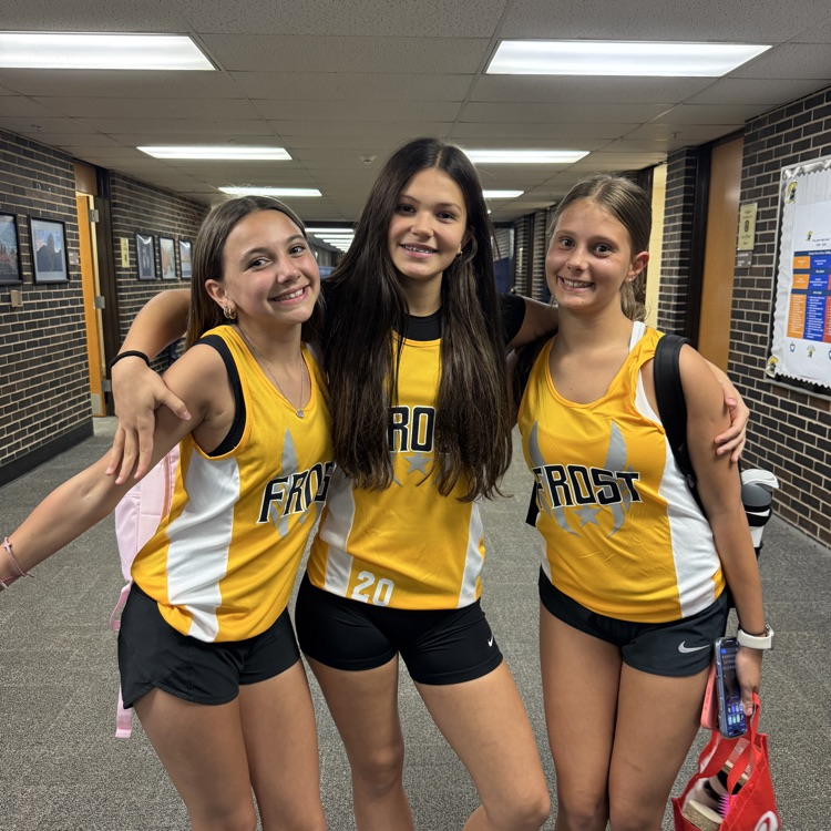 three girls in cross country shirts