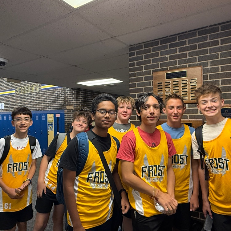 seven boys in cross country shirts
