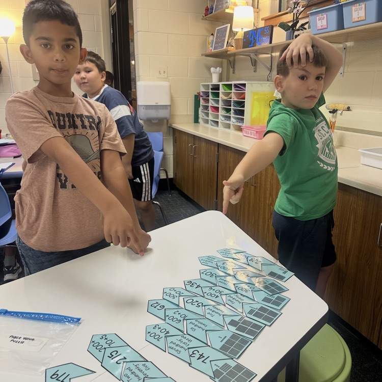 2nd Graders making number puzzles.