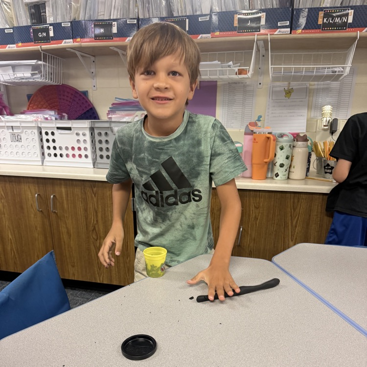 Student making numbers using Playdough