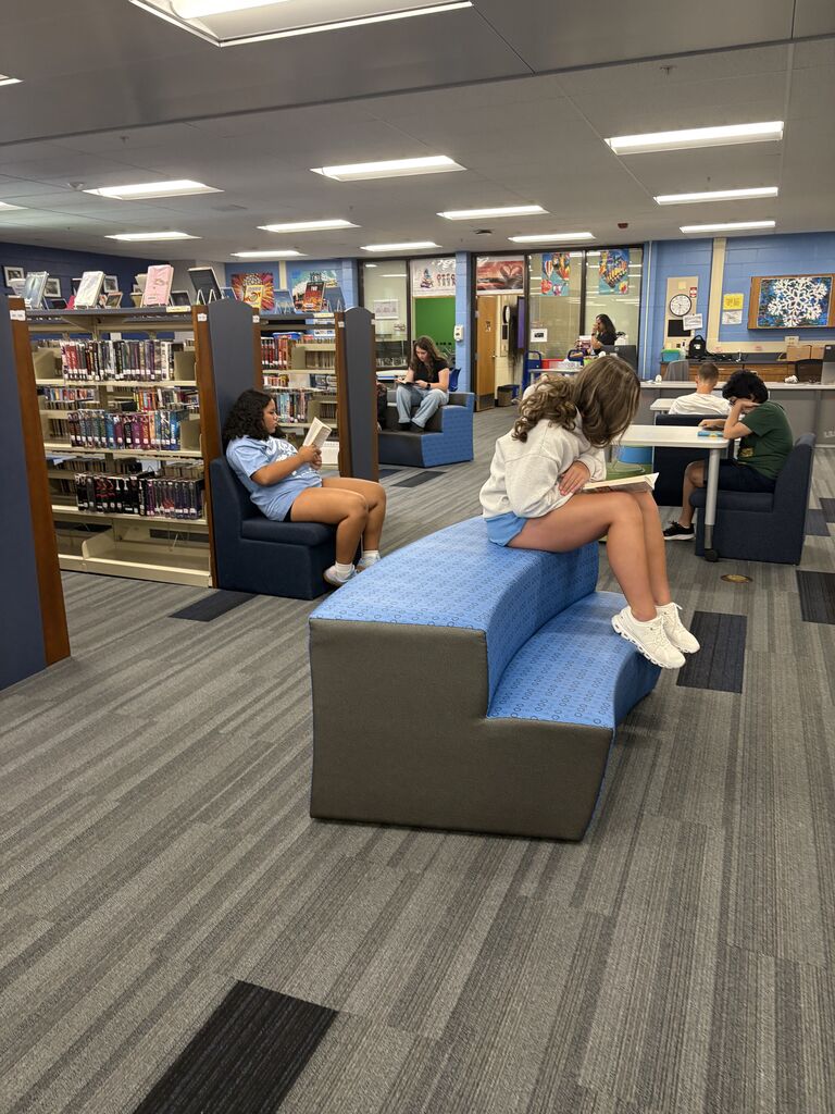 students reading in a library