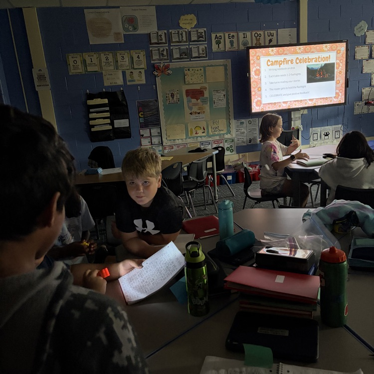 Students reading and writing in the dark. 