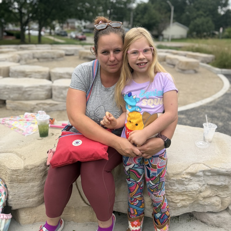 Mother and daughter outside on playground 