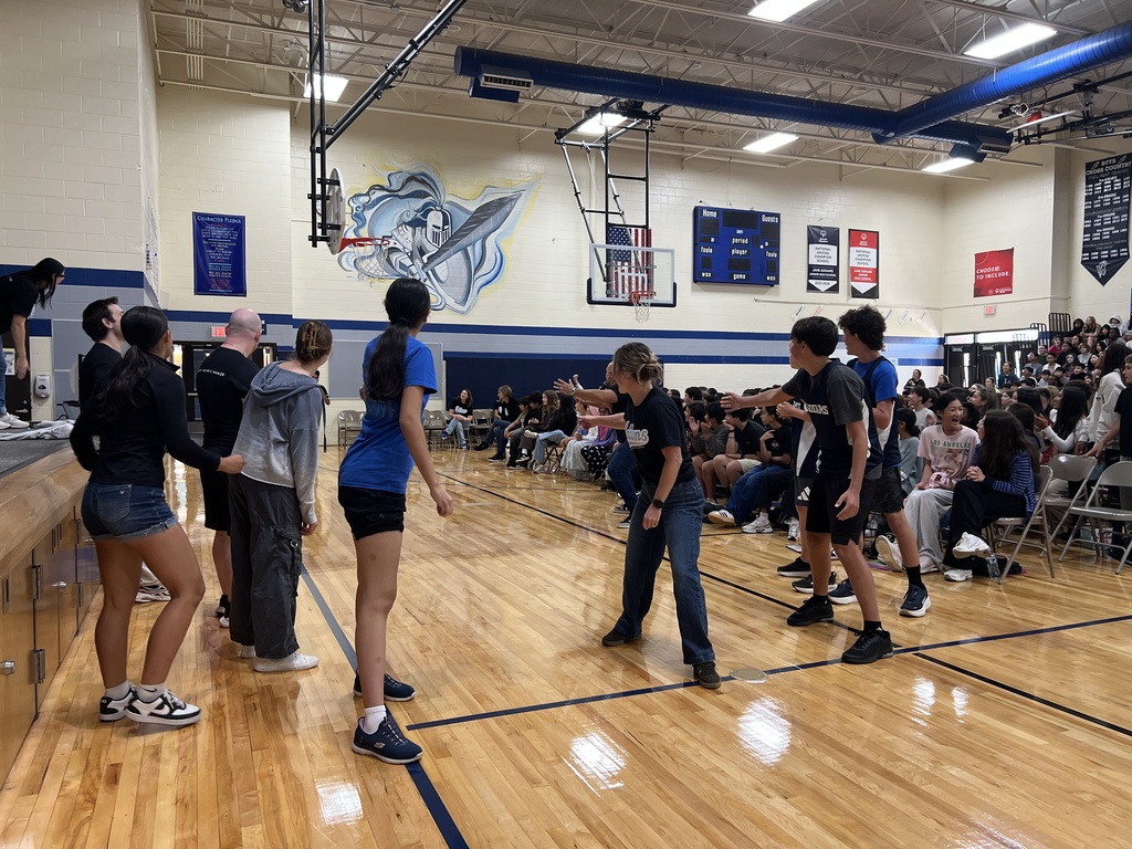 Staff and students participating in a relay race