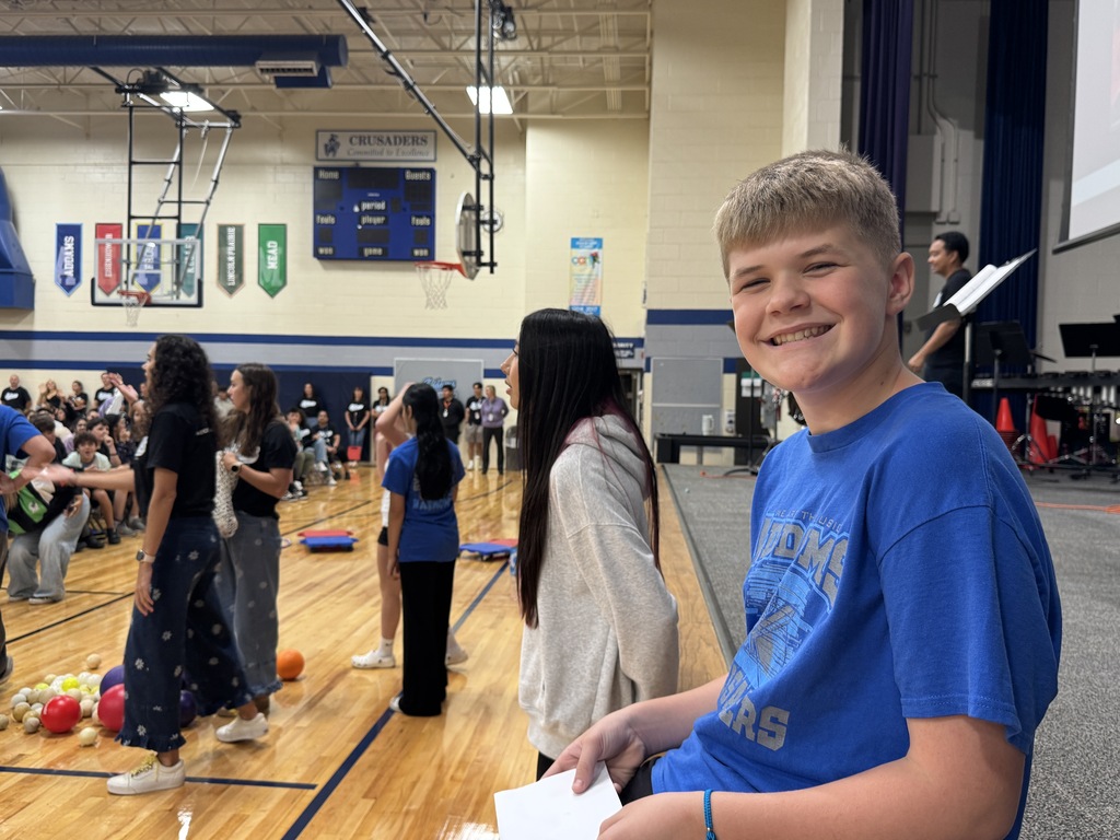 a student smiling at a camera