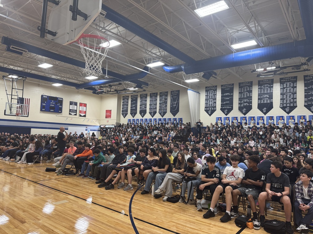 School principal talking at an assembly