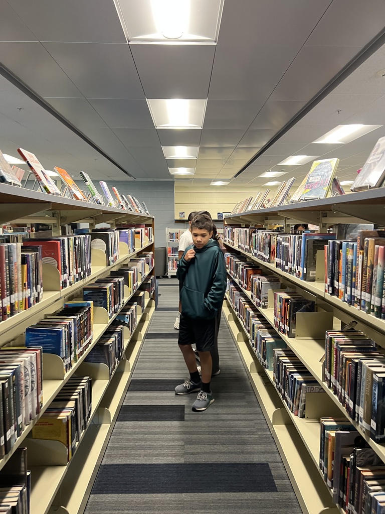 Students searching for books at the library