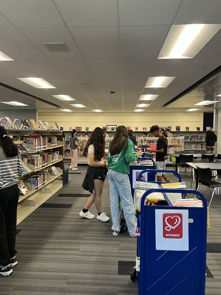Students searching for books at the library