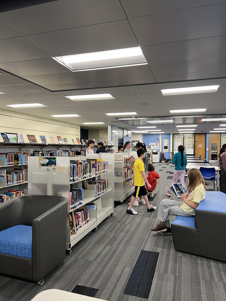 Students searching for books at the library