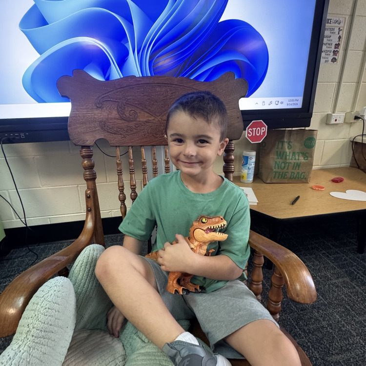 Kindergarten student doing a show and tell. 
