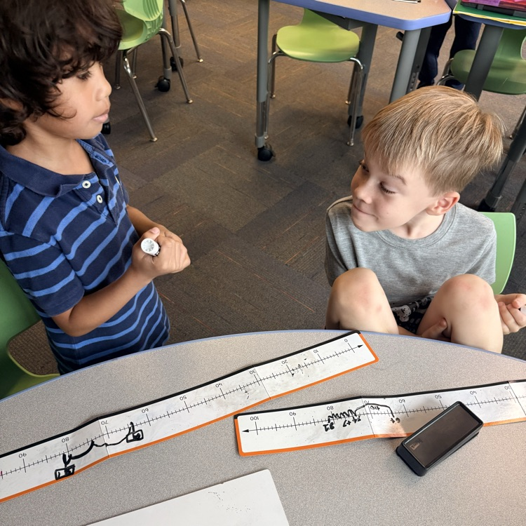 students discussing math work 