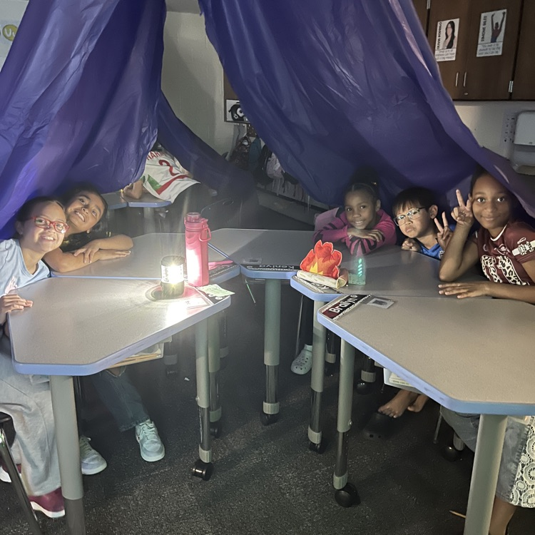 students in a tent
