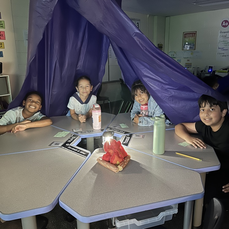 students in a tent
