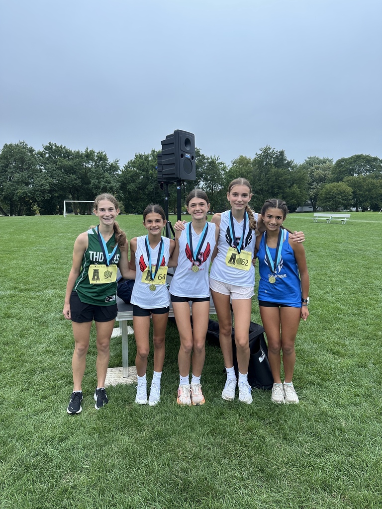 Cross Country runners celebrating their victory