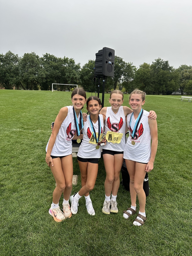Cross Country runners celebrating their victory