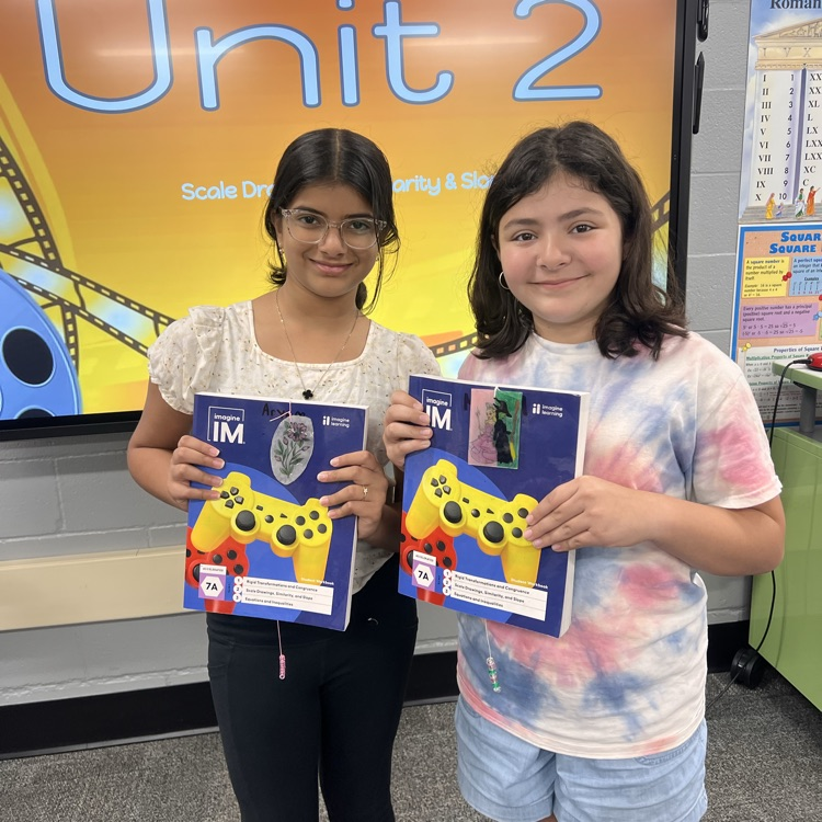 two students showing their bookmarks in their bookmarks