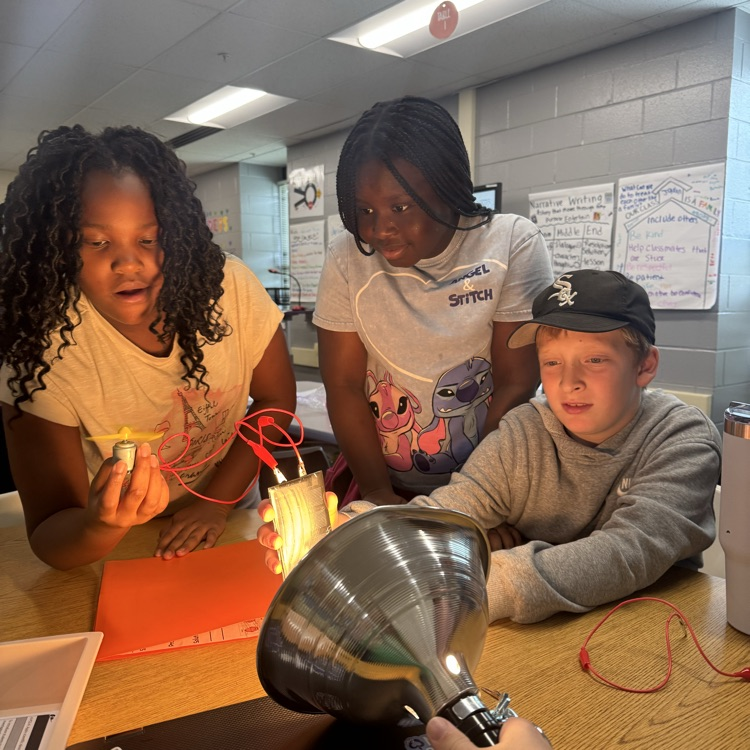 students looking surprised at their experiment