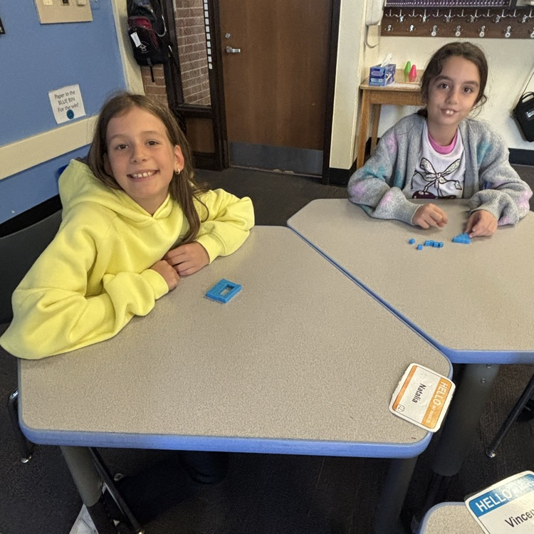 students using blocks to explore the concept of area