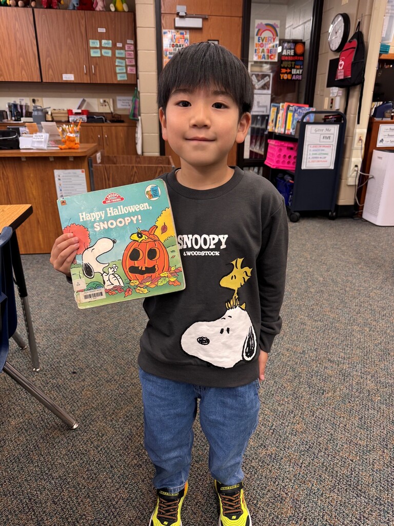 Student with Snoopy shirt and book