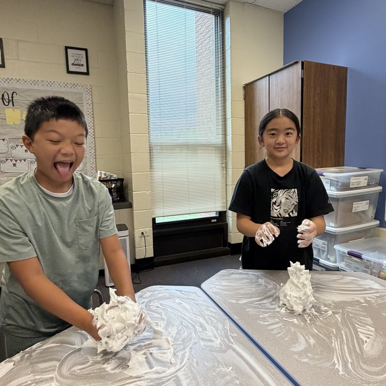 students playing with shaving cream on their desks