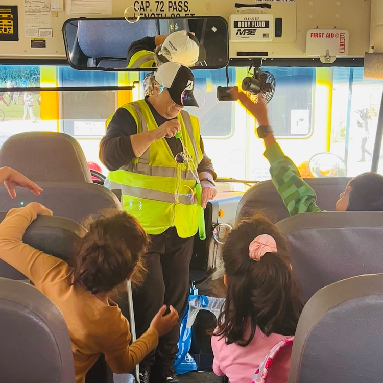 Ms. Diane surprising her bus with bubbles. 
