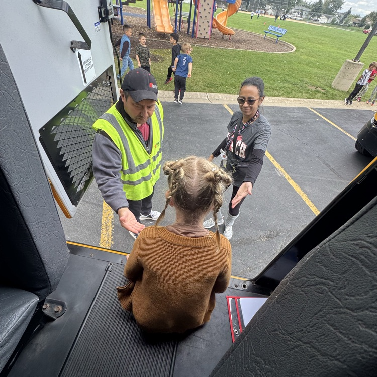 Student practicing getting off the bus. 