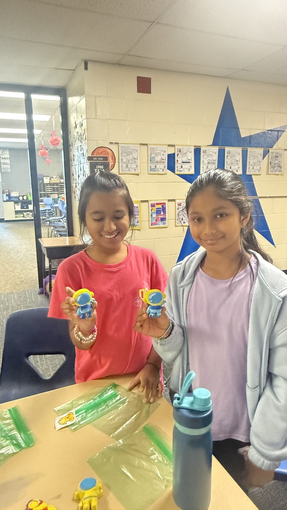 Students holding crafts