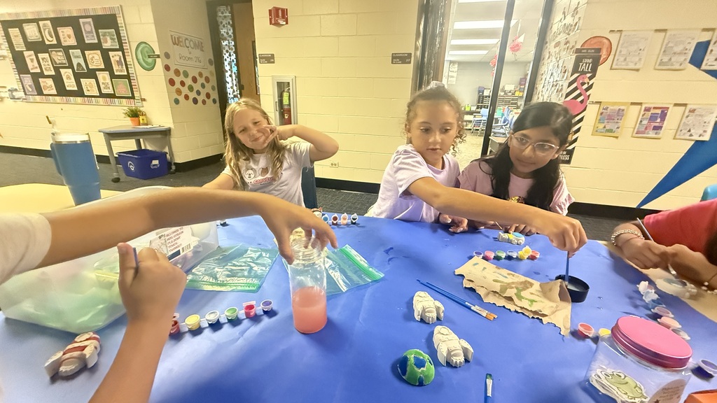 Students holding crafts
