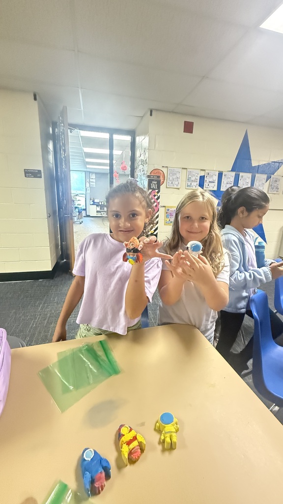 Students holding crafts