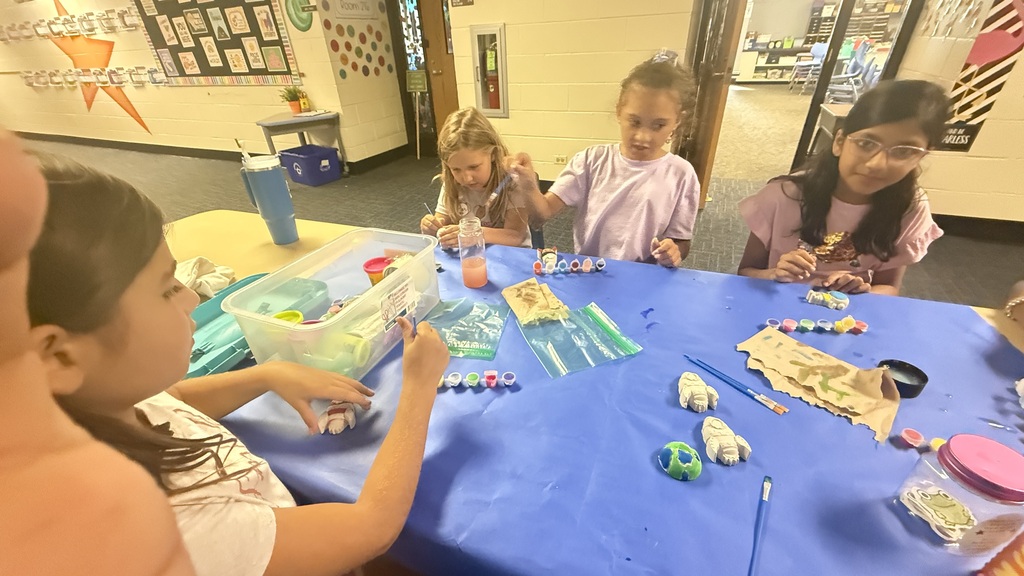 Students holding crafts