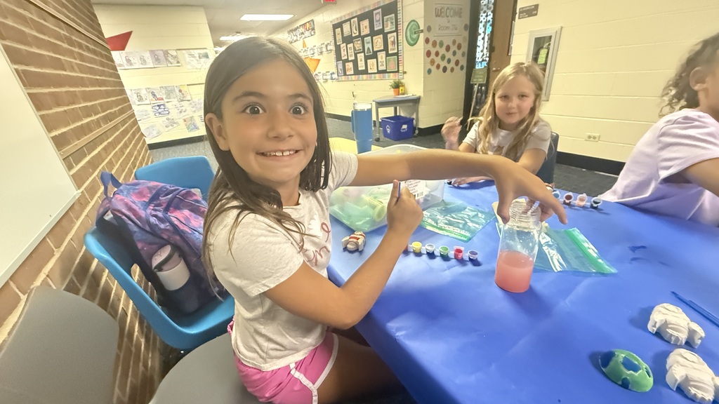Students holding crafts