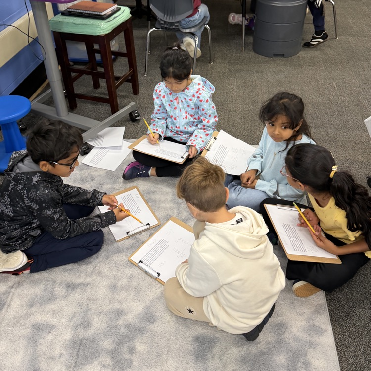 students working together on the floor