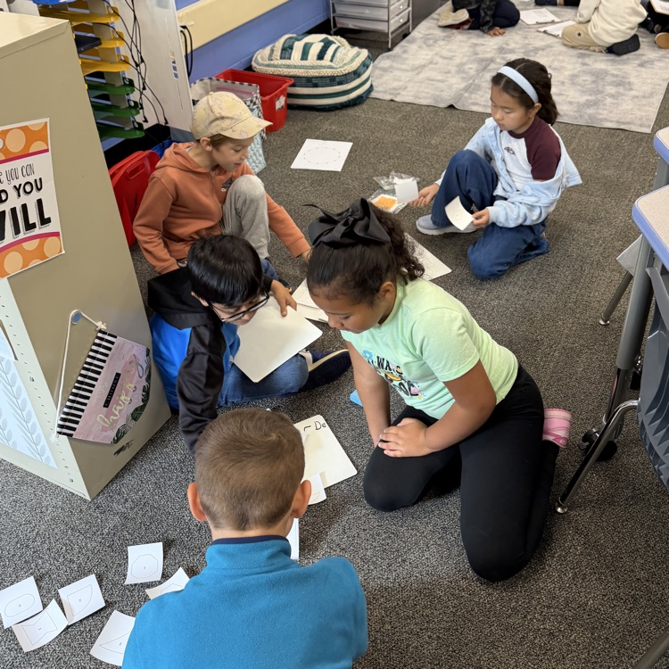 students working together on the floor
