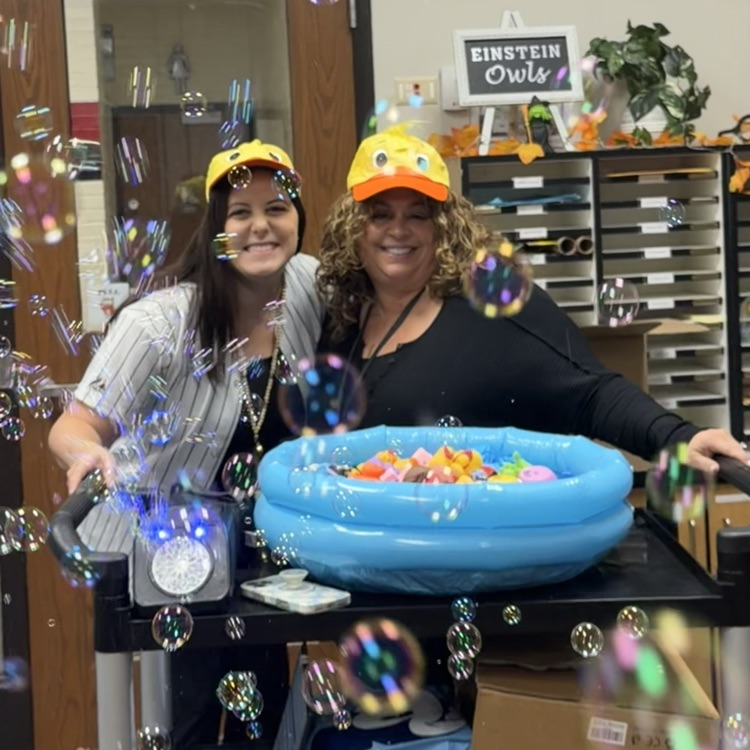 Mrs. Roth and Mrs. Fabbrini with bubbles and a pool of rubber ducks