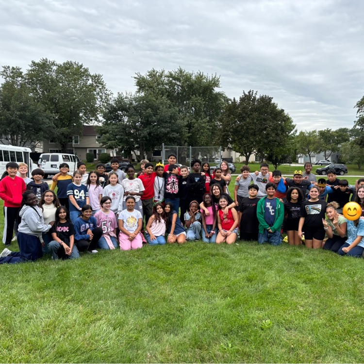 three sixth grade classes posing for a picture