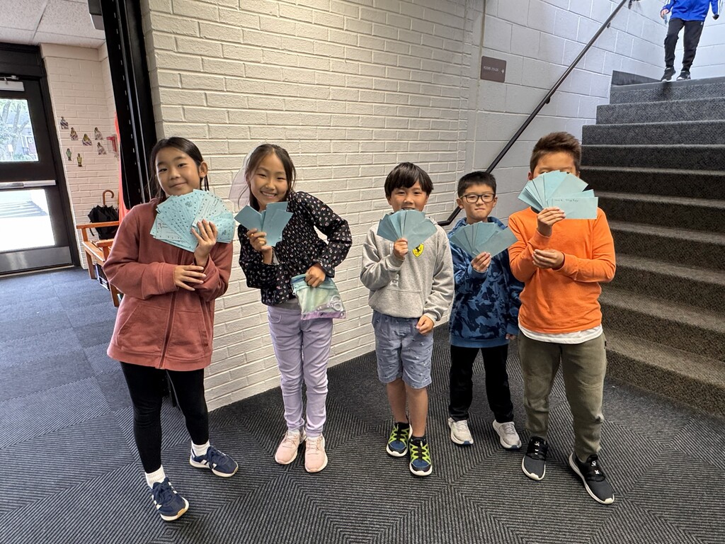 Students with stamp cards for PBIS store