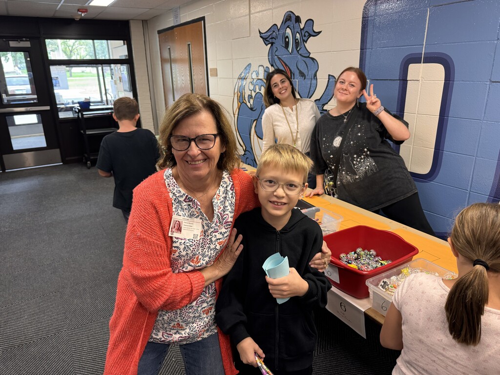 Staff with students at PBIS Store