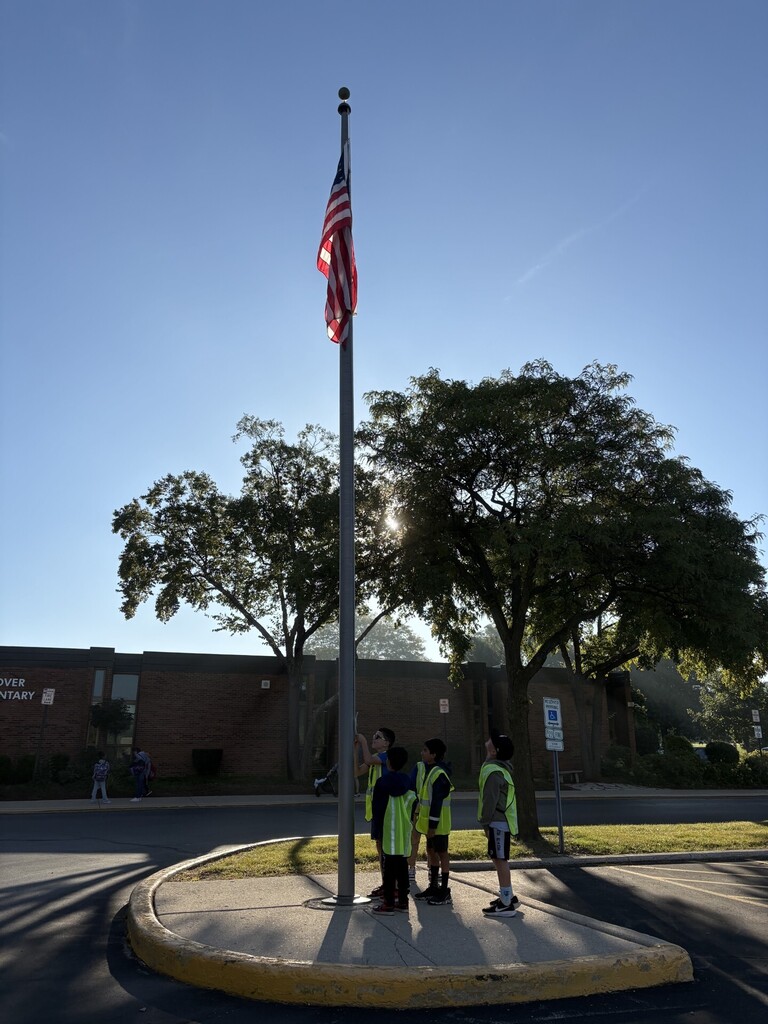 Patrol kids putting up the flag