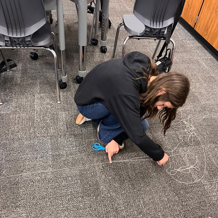 student estimating length with a string