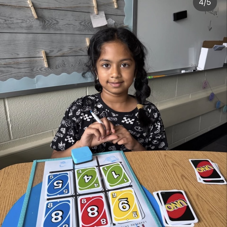 student showing her addition problem 