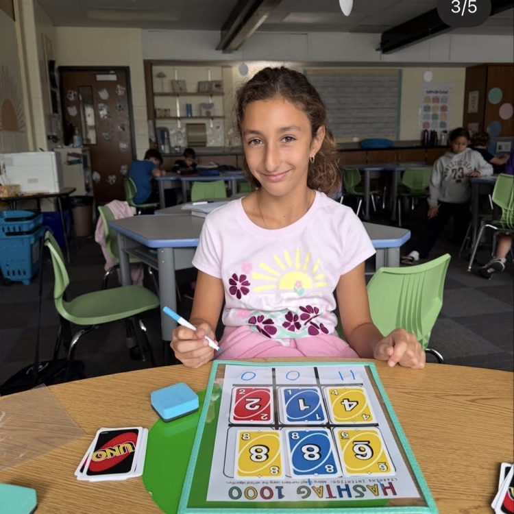 student showing her addition problem 
