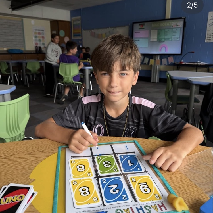 student showing his addition problem 