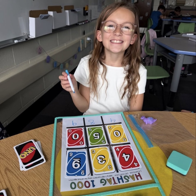 student showing her addition problem 