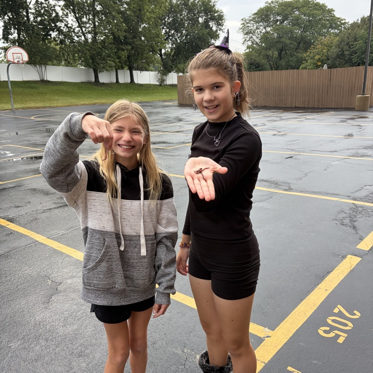 Two students finding worms.