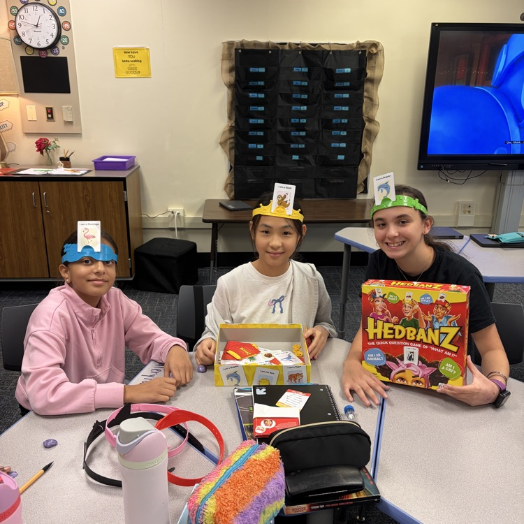 A group of girls playing Headbands.