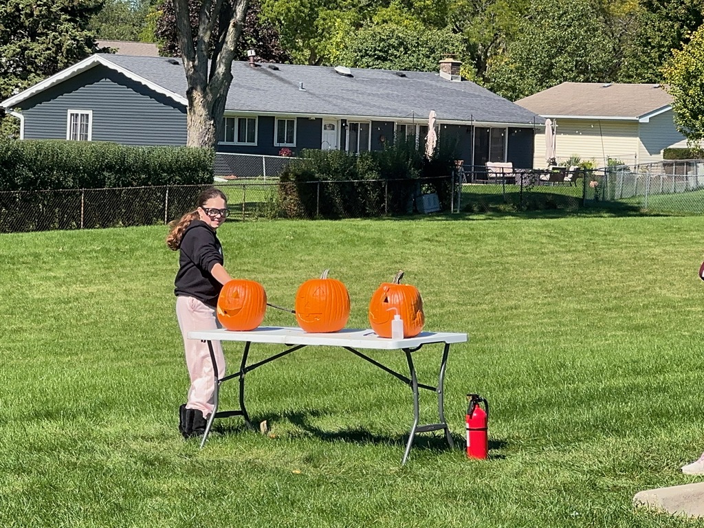 A student creates a chemical reaction to make a self-carving pumpkin