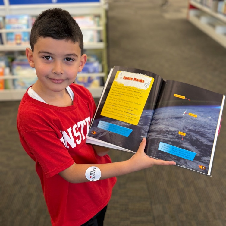 Student showing his book