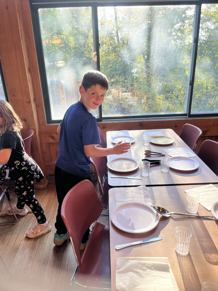 student setting a table