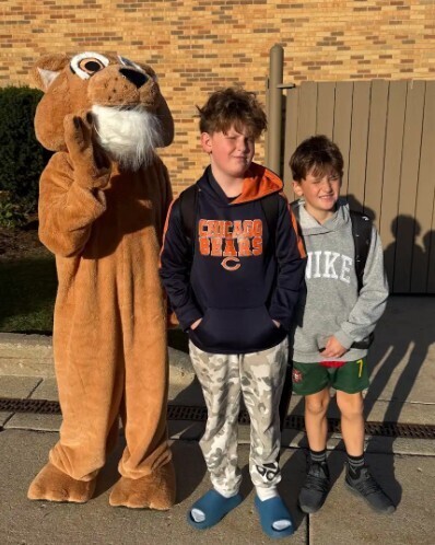 photo of two students standing with Cody